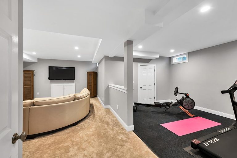 Basement renovation with fitness area