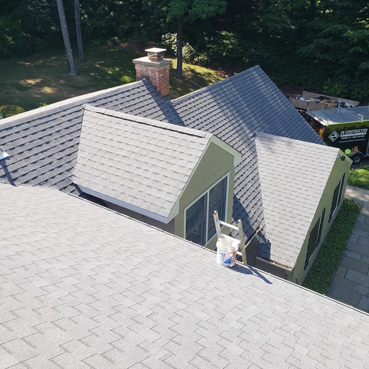 Roofing job on tan house