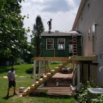 Sunroom rebuild with deck extended