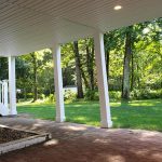 Addition and deck extension above walkout basement