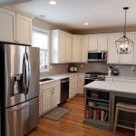 Kitchen renovation done in gray and white cabinetry